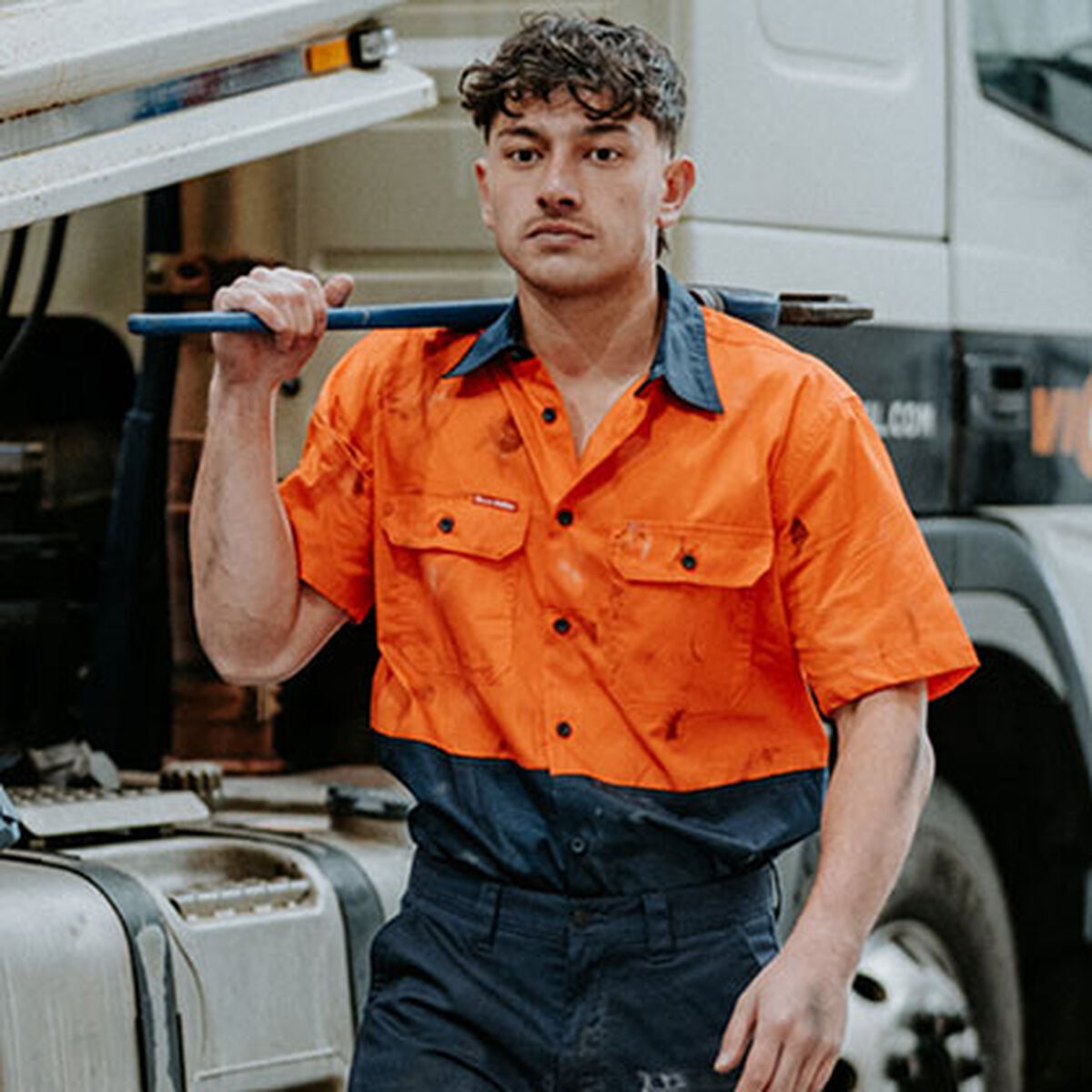 Tradie in a Hard Yakka hi-vis work shirt