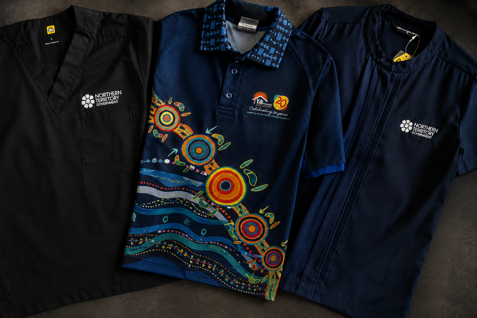 Embroidered jackets and jumpers in navy and black, showing finished client logos.